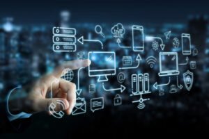 Hand selecting icons on blurred high-tech monitor